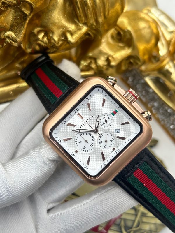 Luxury Gucci-Inspired Chronograph Wristwatch – Rose Gold Square Dial with Signature Stripe Strap Upgrade your style with this premium luxury wristwatch, designed with a perfect blend of sophistication and modern elegance. Featuring a sleek square rose gold case, this timepiece boasts a white chronograph dial with three sub-dials for precision timekeeping. The bold yet refined design is complemented by a black leather strap with Gucci’s signature red and green stripes, adding a touch of high-end fashion to your look. Key Features: ✅ High-Quality Chronograph Movement – Ensures precise timekeeping with stopwatch functionality ✅ Elegant Square Rose Gold Case – A unique and luxurious design that stands out ✅ Premium Leather Strap with Red & Green Stripe – Iconic Gucci-inspired design for a bold fashion statement ✅ Multifunctional Sub-Dials – Display seconds, minutes, and hours for added functionality ✅ Scratch-Resistant Crystal Glass – Durable and long-lasting ✅ Water-Resistant Design – Safe for everyday wear (splash-resistant) ✅ Date Display Window – Convenient date tracking Perfect For: ✔ Fashion Enthusiasts ✔ Luxury Watch Collectors ✔ Gift for Him – Birthdays, Anniversaries, Special Occasions ✔ Business & Casual Wear 💎 Elevate your wrist game with this stylish, high-end timepiece. Limited stock available – order yours today!